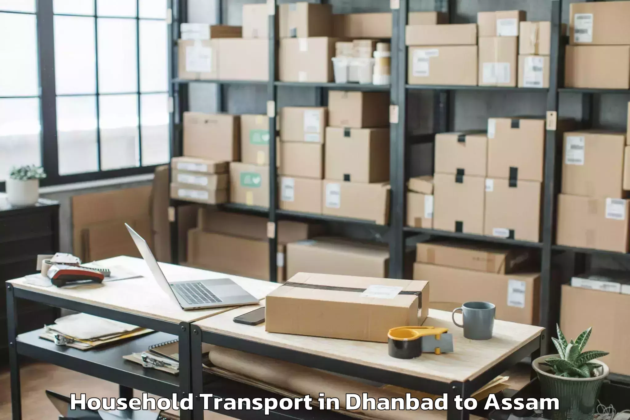 Top Dhanbad to Jamuguri Household Transport Available